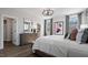 Charming bedroom with warm floors features a bed with bench, chandelier, and large windows at 10624 Pleasant Branch Dr # 7, Raleigh, NC 27614