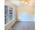Empty bedroom featuring carpeted floors and a bright window for natural light at 1125 Field Meadows Dr, Zebulon, NC 27597