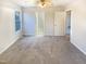 A bright bedroom features neutral paint, carpet, and a window for natural light at 1125 Field Meadows Dr, Zebulon, NC 27597