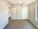 Bedroom featuring carpeted floors, and a door with closet space at 1125 Field Meadows Dr, Zebulon, NC 27597