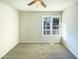 Bedroom with neutral carpet and a window allowing for plenty of natural light at 1125 Field Meadows Dr, Zebulon, NC 27597