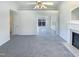 Open-concept living room featuring a fireplace and access to the backyard at 1125 Field Meadows Dr, Zebulon, NC 27597