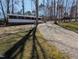 Exterior showing the landscaping, siding, and trees in the property at 122 Tomahawk Dr, Louisburg, NC 27549