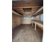 Inside a wooden shed with a workbench and some storage shelves under bright lights at 122 Tomahawk Dr, Louisburg, NC 27549