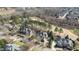An aerial view of residential neighborhood homes, mature trees, and a golf course at 12417 Richmond Run Dr, Raleigh, NC 27614