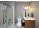 Bathroom with a shower/tub combo, a modern toilet, and a vanity at 12417 Richmond Run Dr, Raleigh, NC 27614