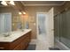 This spacious bathroom has a double sink vanity, tub/shower and adjacent toilet at 12417 Richmond Run Dr, Raleigh, NC 27614