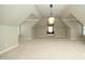 Finished bonus room featuring neutral colored walls, recessed lighting and a window seat at 12417 Richmond Run Dr, Raleigh, NC 27614
