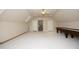 Spacious bonus room featuring plush carpet, recessed lights, and space for a pool table at 12417 Richmond Run Dr, Raleigh, NC 27614