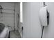 Attached garage with a Tesla charging station and roll up door for convenient and secure parking at 12417 Richmond Run Dr, Raleigh, NC 27614