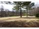 Scenic golf course view with mature trees and lush landscaping at 12417 Richmond Run Dr, Raleigh, NC 27614