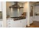 Gourmet kitchen features stainless steel appliances, stylish tile backsplash, and ample storage at 12417 Richmond Run Dr, Raleigh, NC 27614