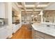 Gourmet kitchen featuring granite counters, stainless appliances, and seamless flow to the breakfast area at 12417 Richmond Run Dr, Raleigh, NC 27614