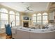 Open-concept living area with fireplace, large windows, and stylish furnishings at 12417 Richmond Run Dr, Raleigh, NC 27614