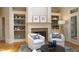 Inviting living room with fireplace, built-in shelves, and comfortable seating area at 12417 Richmond Run Dr, Raleigh, NC 27614