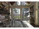 Porch has a stone fireplace, grill, bar-height seating, and panoramic views at 12417 Richmond Run Dr, Raleigh, NC 27614