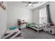 bedroom with two twin beds, a desk, and a play kitchen at 133 Alumroot Road Rd, Holly Springs, NC 27540