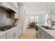 Modern kitchen with stainless steel appliances and granite countertops at 133 Alumroot Road Rd, Holly Springs, NC 27540