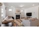 Comfortable living room includes a fireplace and television at 133 Alumroot Road Rd, Holly Springs, NC 27540
