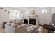 Cozy living room features a fireplace and neutral decor at 133 Alumroot Road Rd, Holly Springs, NC 27540
