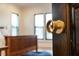 Bedroom through open door featuring a wooden bed frame and natural light at 1354 Briar Chapel Pkwy, Chapel Hill, NC 27516