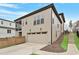 Exterior angle of a two-story home featuring garage, back porch, and professional landscaping at 1354 Briar Chapel Pkwy, Chapel Hill, NC 27516
