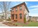 Two-story brick home, showcasing manicured landscaping and architectural details at 1354 Briar Chapel Pkwy, Chapel Hill, NC 27516
