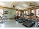Gym area features treadmills and stationary bikes in a well lit space at 1354 Briar Chapel Pkwy, Chapel Hill, NC 27516