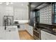 Modern kitchen with stainless steel appliances, sleek white cabinets, and stylish backsplash at 1354 Briar Chapel Pkwy, Chapel Hill, NC 27516