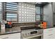 Close-up of modern kitchen area with stainless steel stove and decorative tile backsplash at 1354 Briar Chapel Pkwy, Chapel Hill, NC 27516