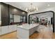 Spacious kitchen with a large island and open view to the stylish living room at 1354 Briar Chapel Pkwy, Chapel Hill, NC 27516
