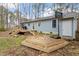 Backyard featuring a deck, a basketball hoop, and a spacious yard at 136 Dixie Ln, Youngsville, NC 27596