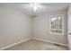 Empty bedroom featuring neutral walls, a ceiling fan, and a bright window at 136 Dixie Ln, Youngsville, NC 27596