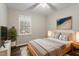 Cozy bedroom with a well-placed bed, side tables, and view of backyard at 136 Dixie Ln, Youngsville, NC 27596
