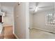 View of a well-lit bedroom with a ceiling fan, a window, and neutral-colored walls at 136 Dixie Ln, Youngsville, NC 27596