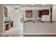 Bright kitchen featuring dark wood cabinets and a breakfast bar at 136 Dixie Ln, Youngsville, NC 27596