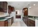 Charming kitchen with stainless steel appliances and dark wood cabinetry at 136 Dixie Ln, Youngsville, NC 27596