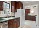 Spacious kitchen featuring wood cabinetry and green countertops at 136 Dixie Ln, Youngsville, NC 27596