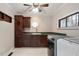 Bright laundry room featuring modern washer and dryer, custom cabinetry, a sink, and natural light at 136 Dixie Ln, Youngsville, NC 27596