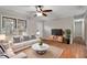 Inviting living room featuring a bright seating area and hardwood flooring at 136 Dixie Ln, Youngsville, NC 27596