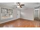 Bright and airy living room with large window and hardwood floors at 136 Dixie Ln, Youngsville, NC 27596