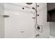 Shower with white subway tile and brushed metal shower head at 136 Dixie Ln, Youngsville, NC 27596