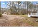 Expansive yard space with potential for landscaping or outdoor activities at 136 Dixie Ln, Youngsville, NC 27596