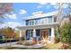 Charming two-story home with a welcoming front porch, manicured lawn, and classic architectural details at 1608 Scales St, Raleigh, NC 27608