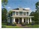 Charming two-story home featuring a welcoming front porch, manicured lawn, and classic architectural details at 1608 Scales St, Raleigh, NC 27608