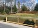 Wide view of the large backyard with a wood fence, providing ample space for various outdoor activities at 2112 Hamrick Dr, Raleigh, NC 27615
