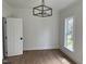 Dining room featuring a stylish light fixture, natural light from a window, and neutral decor at 2112 Hamrick Dr, Raleigh, NC 27615