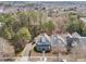 Aerial view of a blue two-story home nestled in a neighborhood surrounded by trees at 2118 Cloud Cover Ln, Raleigh, NC 27614