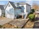 Charming backyard featuring a stone patio, deck, and access to the two-car garage at 2118 Cloud Cover Ln, Raleigh, NC 27614