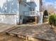 Charming backyard featuring a stone patio, deck, and access to the two-car garage at 2118 Cloud Cover Ln, Raleigh, NC 27614